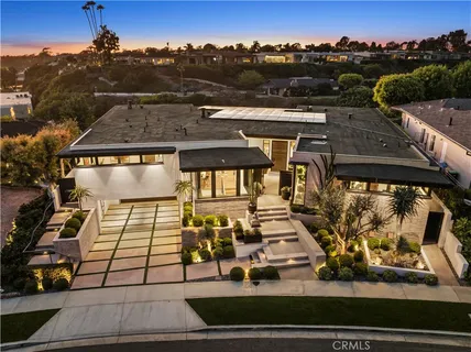 an aerial view of a house with a garden