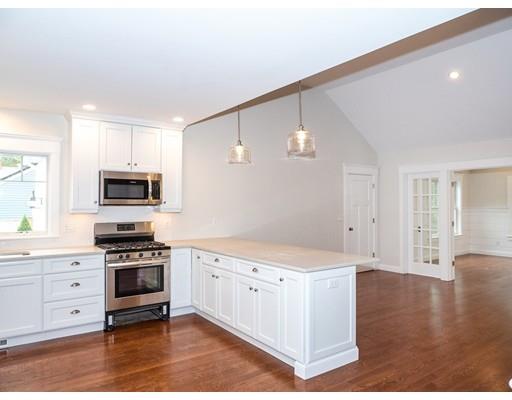 218 Bumps River Road Barnstable, MA 02655 - Photo 4 of 11 a kitchen with granite countertop a stove a sink and a refrigerator