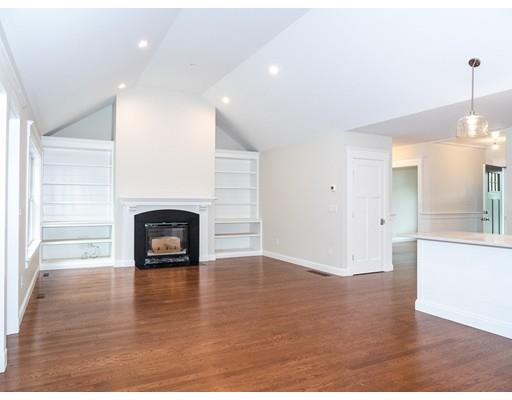 218 Bumps River Road Barnstable, MA 02655 - Photo 5 of 11 a view of empty room with a fireplace