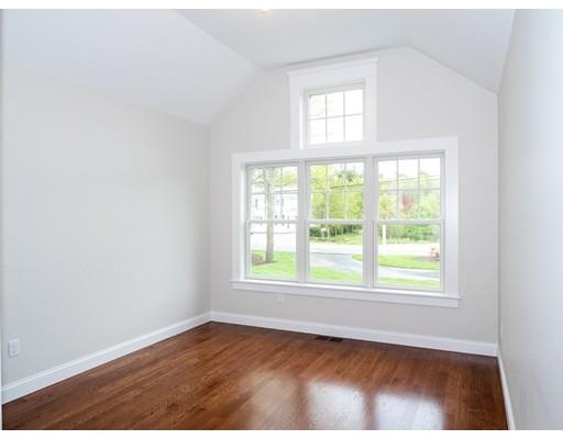 218 Bumps River Road Barnstable, MA 02655 - Photo 6 of 11 an empty room with wooden floor and windows