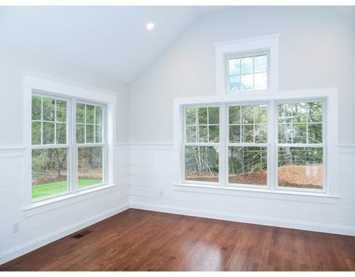 218 Bumps River Road Barnstable, MA 02655 - Photo 7 of 11 an empty room with wooden floor and windows