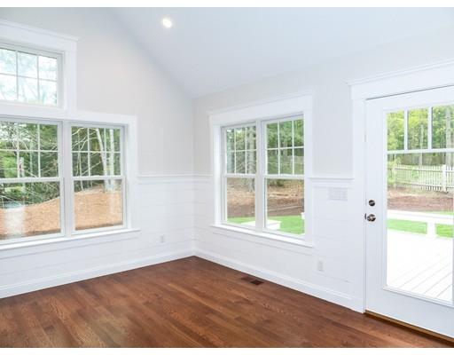 218 Bumps River Road Barnstable, MA 02655 - Photo 8 of 11 an empty room with wooden floor and windows