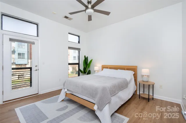 a bedroom with a bed and window