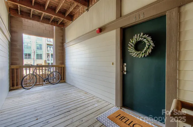 a view of front door with wooden floor