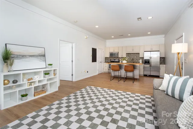 a living room with furniture and a table