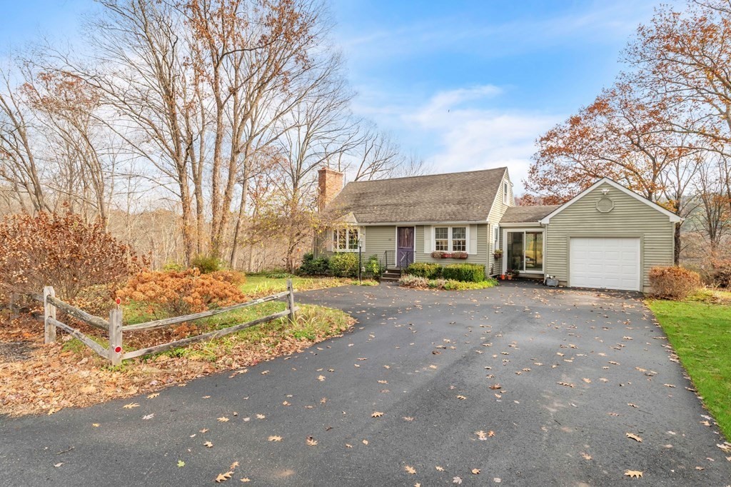 149 Boston Road Palmer, MA 01069 - Photo 1 of 35 a front view of a house with a yard and garage