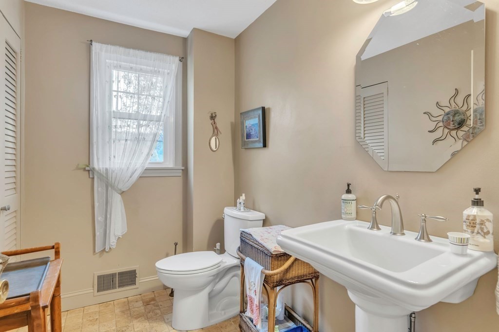 149 Boston Road Palmer, MA 01069 - Photo 17 of 35 a bathroom with a sink a toilet and a mirror