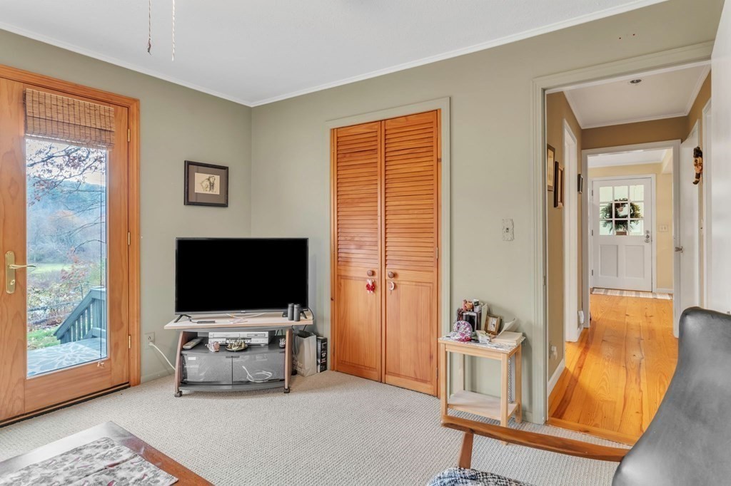 149 Boston Road Palmer, MA 01069 - Photo 19 of 35 a living room with furniture and a flat screen tv