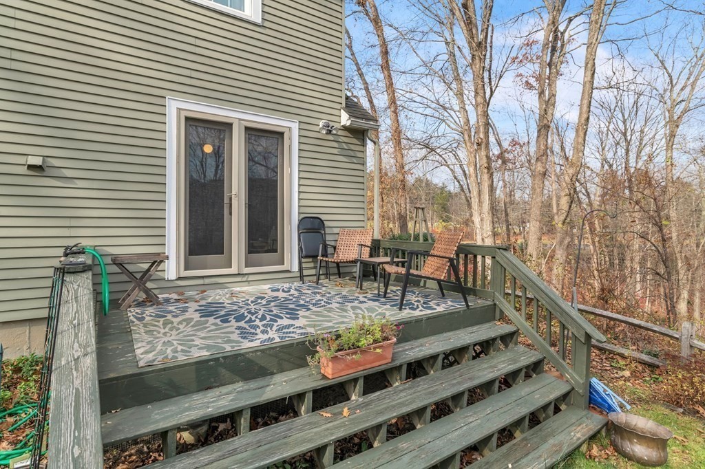 149 Boston Road Palmer, MA 01069 - Photo 27 of 35 a view of a balcony with two chairs and a barbeque