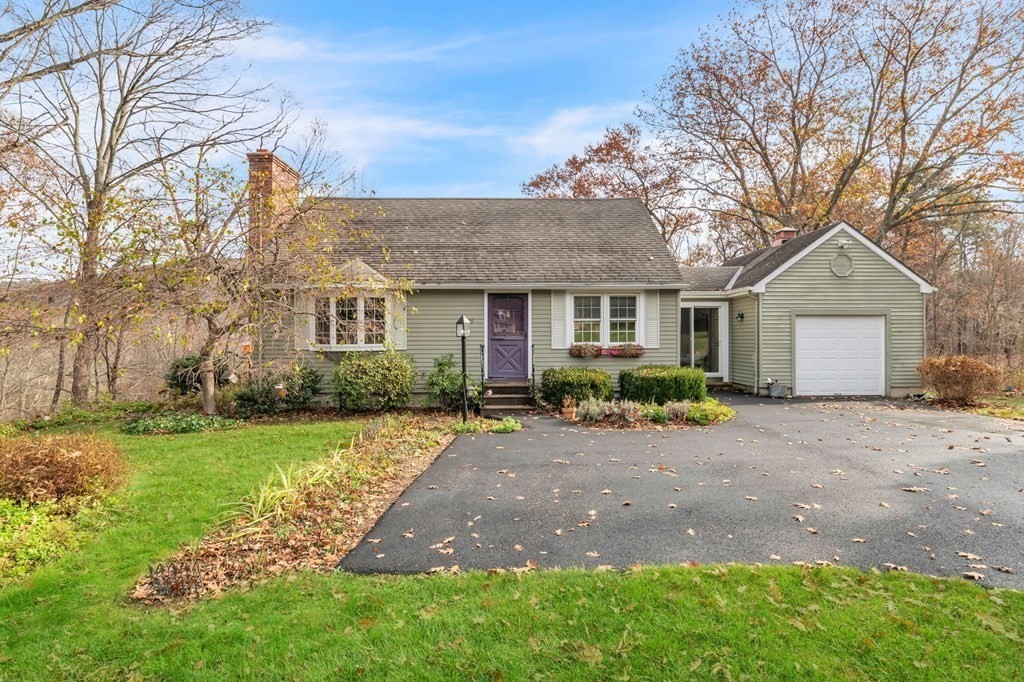 149 Boston Road Palmer, MA 01069 - Photo 5 of 35 a front view of a house with a garden and trees