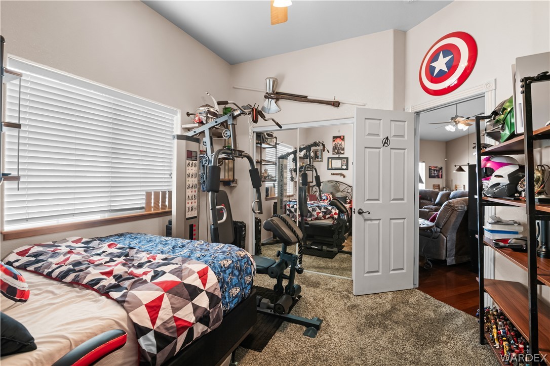 2898 Mountain Trail Road Kingman, AZ 86401 - Photo 26 of 75 a bedroom with a bed and a desk