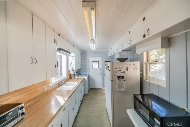 a bed room with a bed and a window