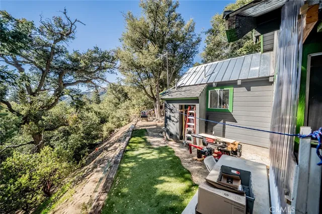 a view of a chair and table in the balcony