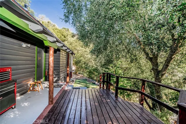 a view of balcony with wooden floor and outdoor seating