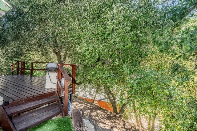 a view of a backyard with sitting area