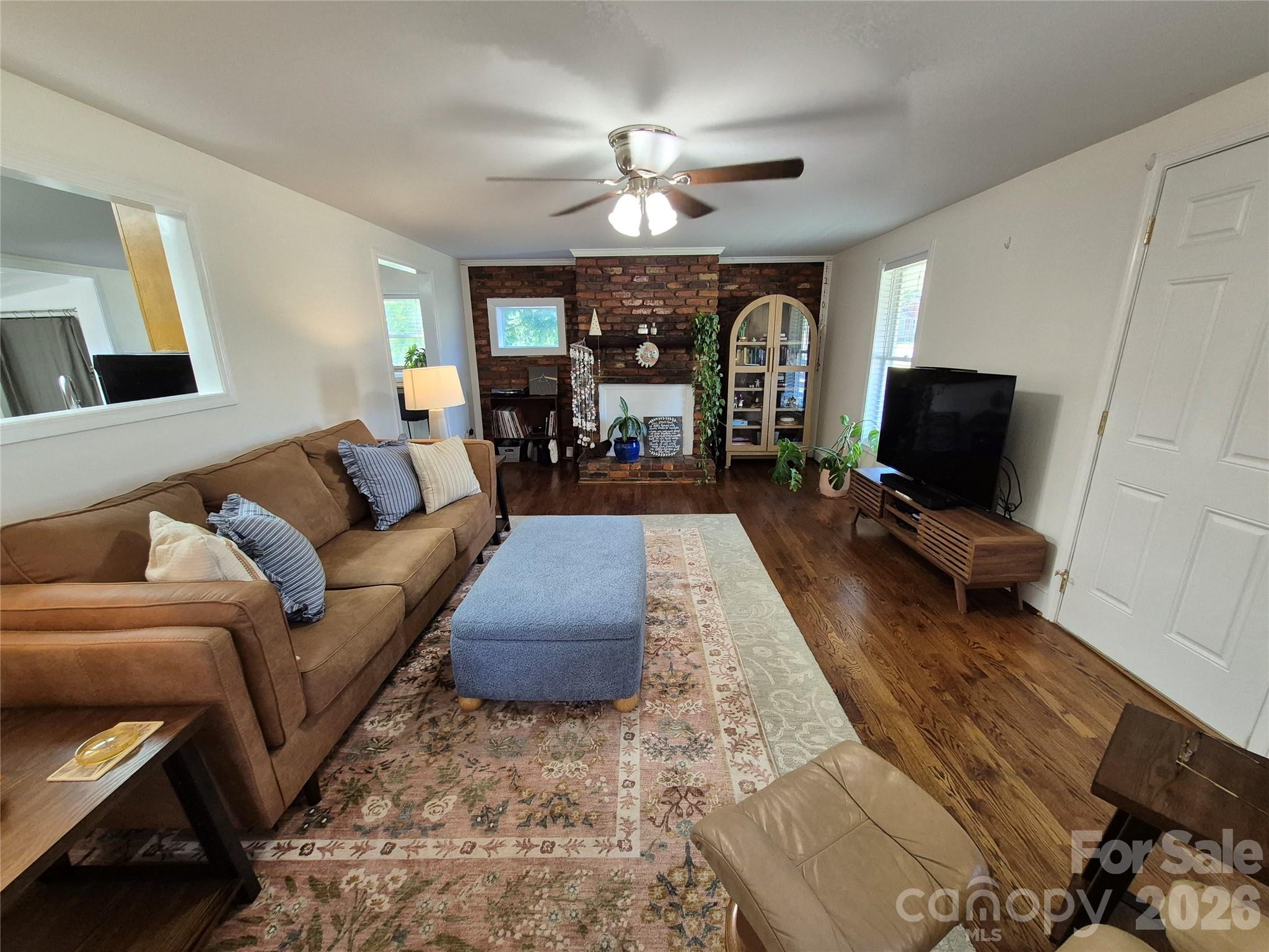 4438 Reepsville Road Vale, NC 28168 - Photo 13 of 32 a living room with furniture and a chandelier