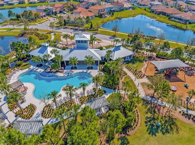an aerial view of residential houses with outdoor space
