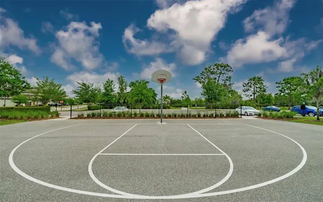 a sign board with buildings in the background