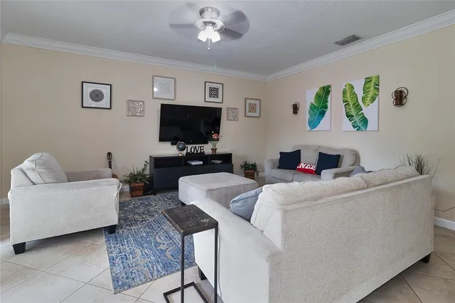 a living room with furniture and a large mirror