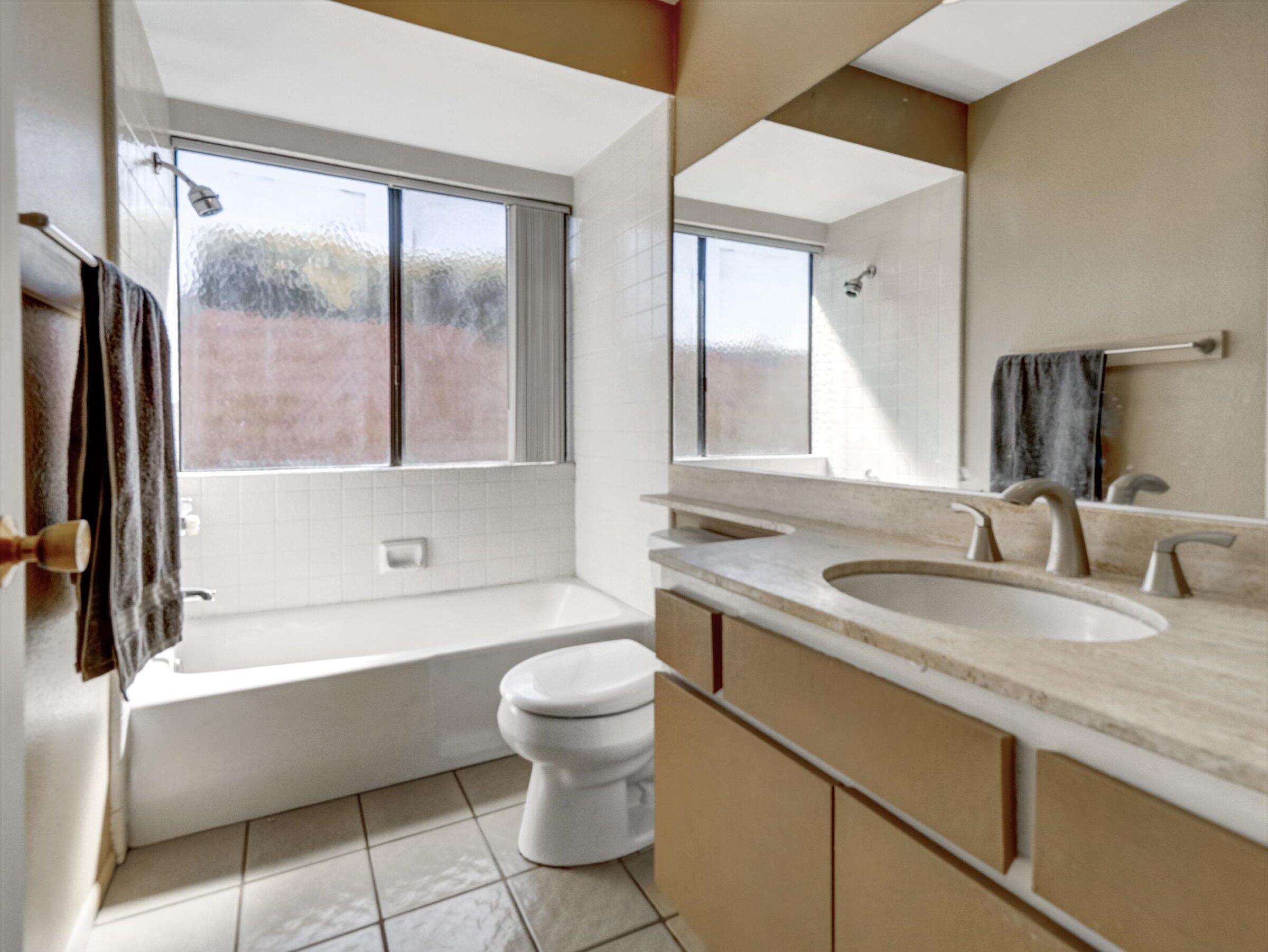 67805 Foothill Road Cathedral City, CA 92234 - Photo 16 of 22 a bathroom with a sink a toilet and a bathtub