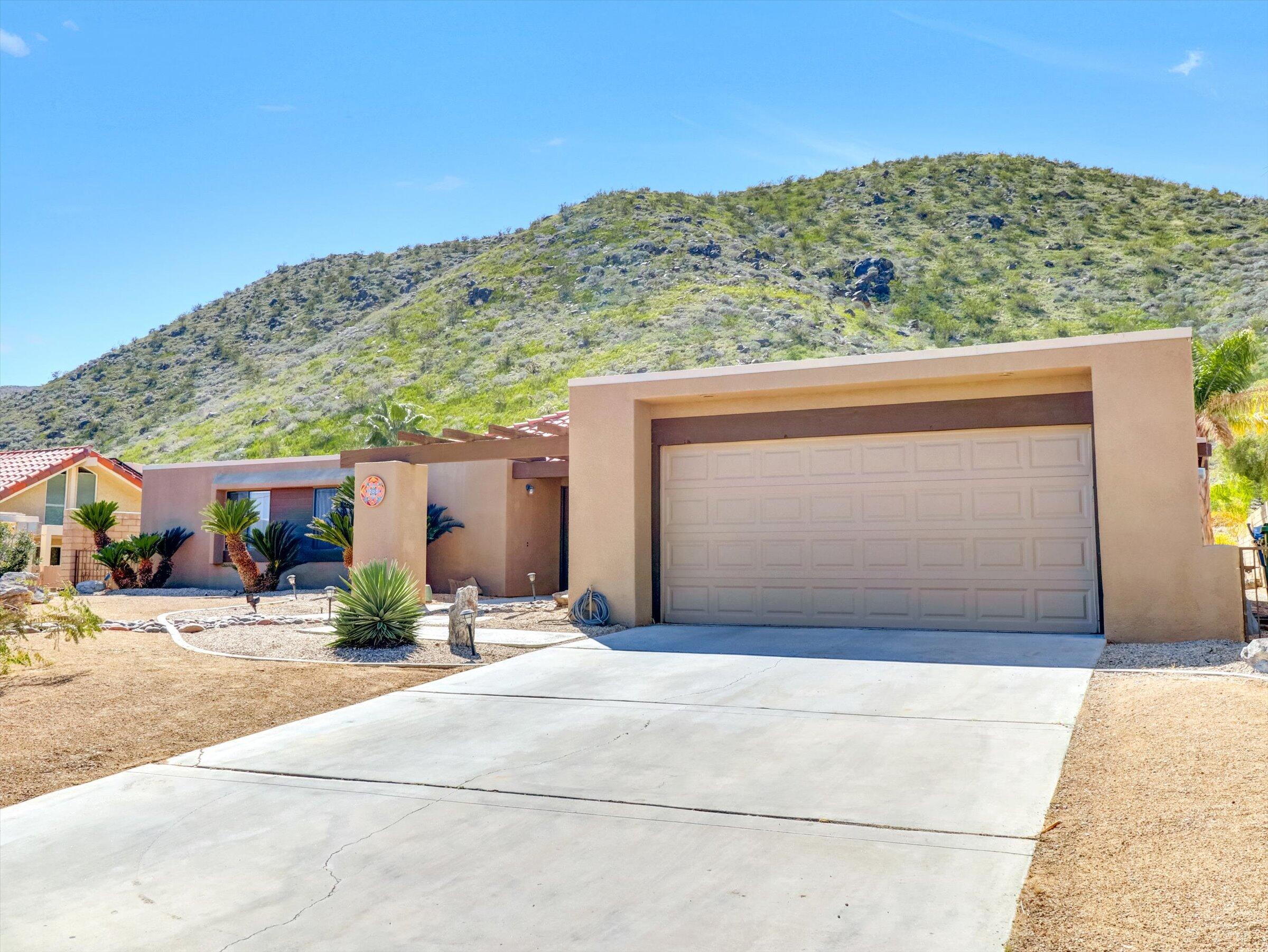 67805 Foothill Road Cathedral City, CA 92234 - Photo 7 of 22 a front view of a house with a yard