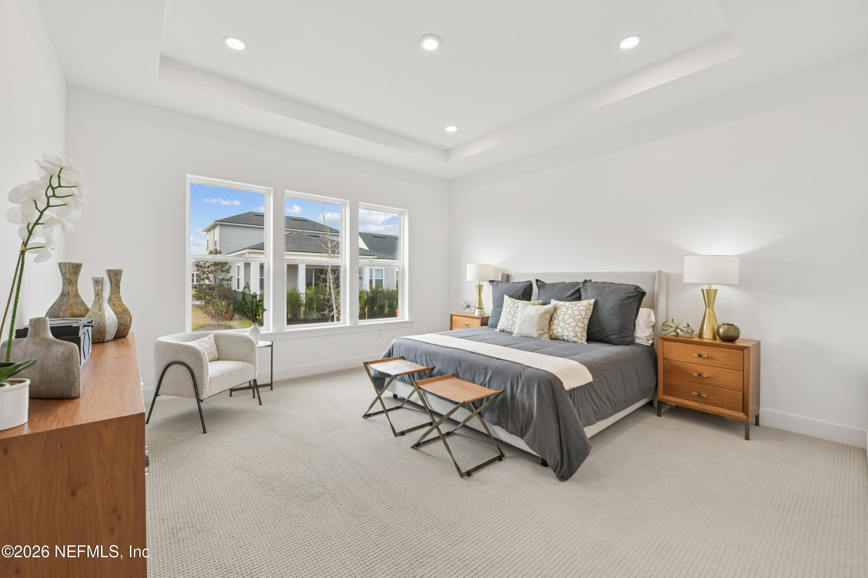 195 Bismarck Palm Road St. Augustine, FL 32092 - Photo 11 of 25 a spacious bedroom with a bed and a large window