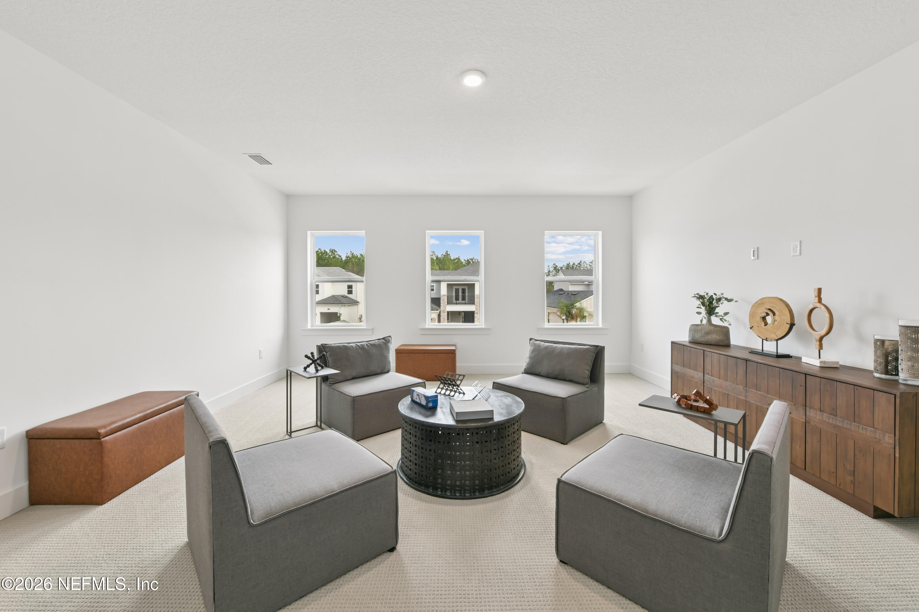 195 Bismarck Palm Road St. Augustine, FL 32092 - Photo 13 of 25 a living room with furniture and a potted plant