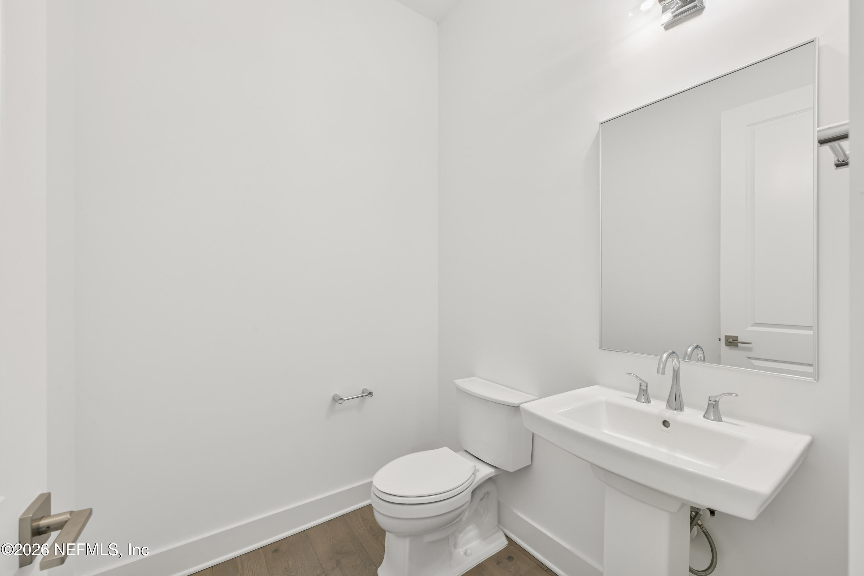 195 Bismarck Palm Road St. Augustine, FL 32092 - Photo 15 of 25 a bathroom with a toilet sink and mirror