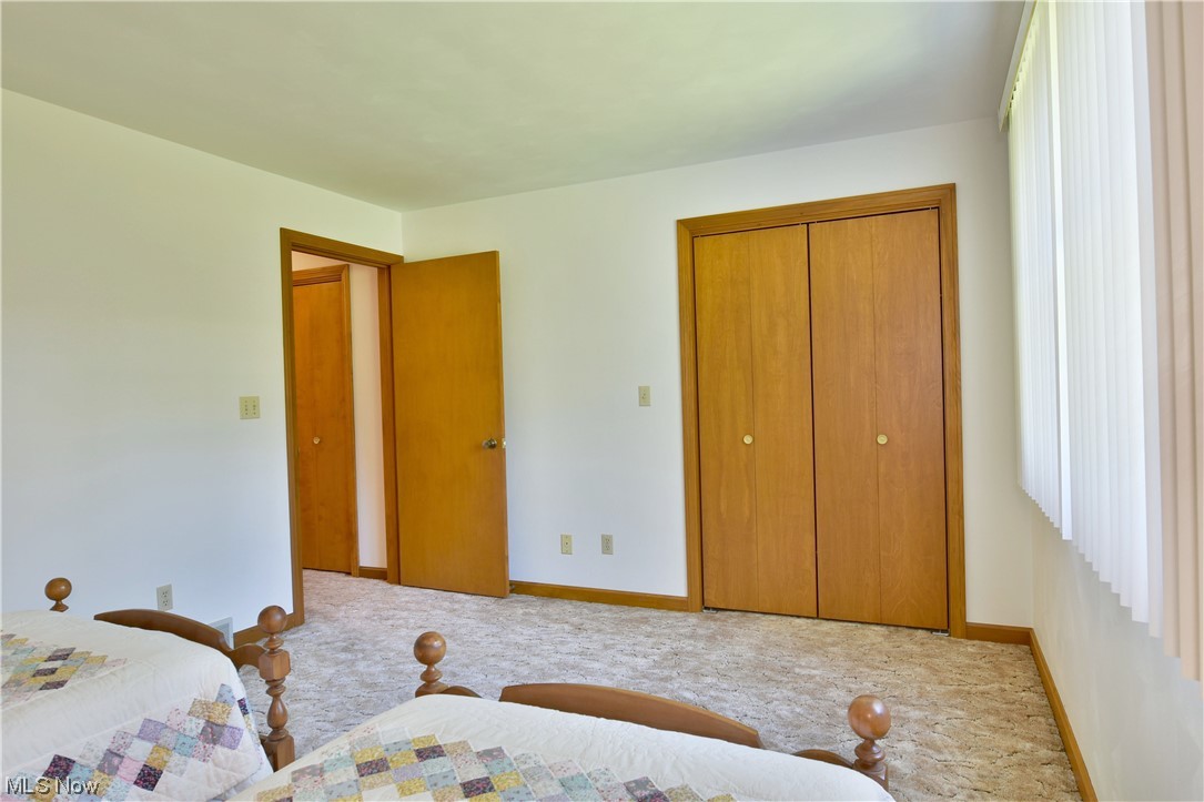 1943 Kale Adams Road Southwest Warren, OH 44481 - Photo 29 of 35 Bedroom featuring light carpet