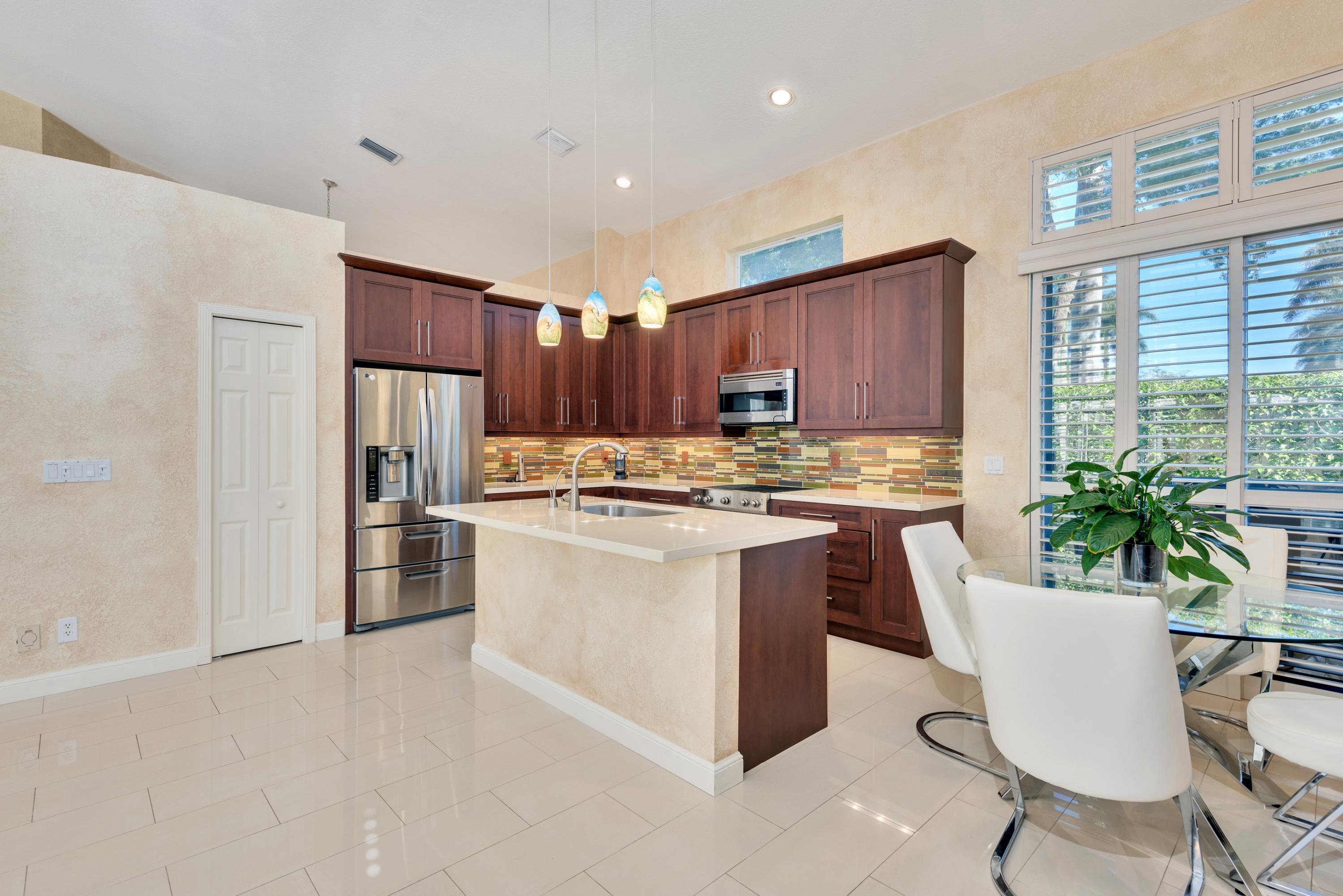 6020 Northwest 42nd Way Boca Raton, FL 33496 - Photo 6 of 54 sleek kitchen