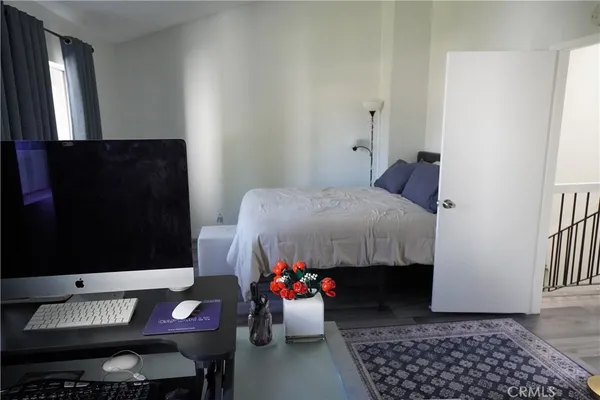 a bedroom with bed and a walk in closet