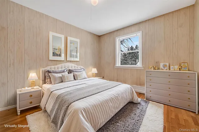 a spacious bedroom with a bed and a couch