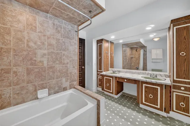 a bedroom with a bed and a potted plant