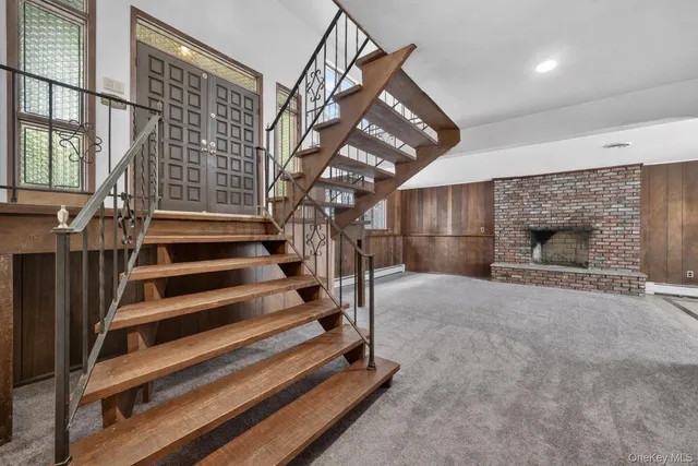 a spacious bathroom with a granite countertop sink and a bathtub