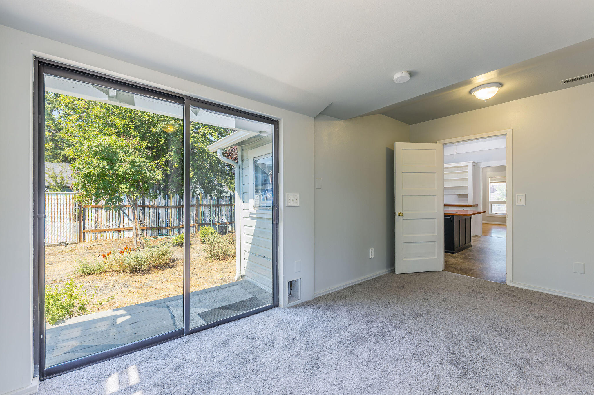 400 Wagner Creek Road Talent, OR 97540 - Photo 14 of 33 an empty room with windows and view of balcony