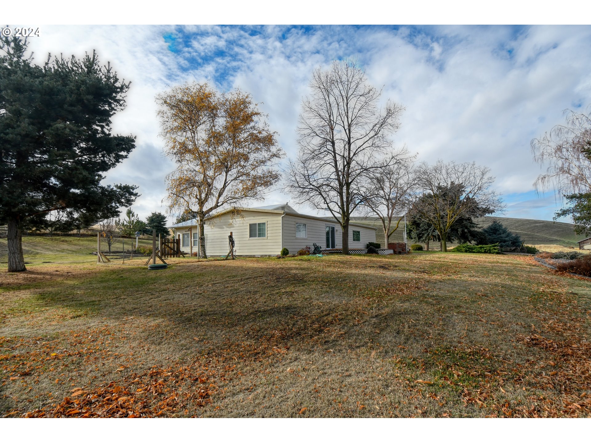 78772 South Cold Spring Road Pendleton, OR 97801 - Photo 3 of 48 a view of a yard with a house