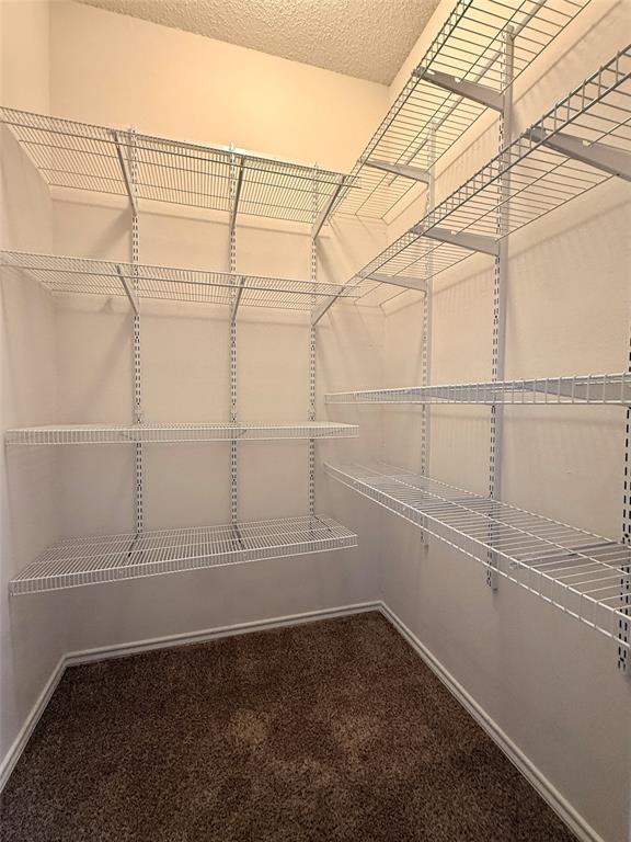 14277 Preston Road, Unit 512 Dallas, TX 75254 - Photo 8 of 8 a view of a room with racks on the wall
