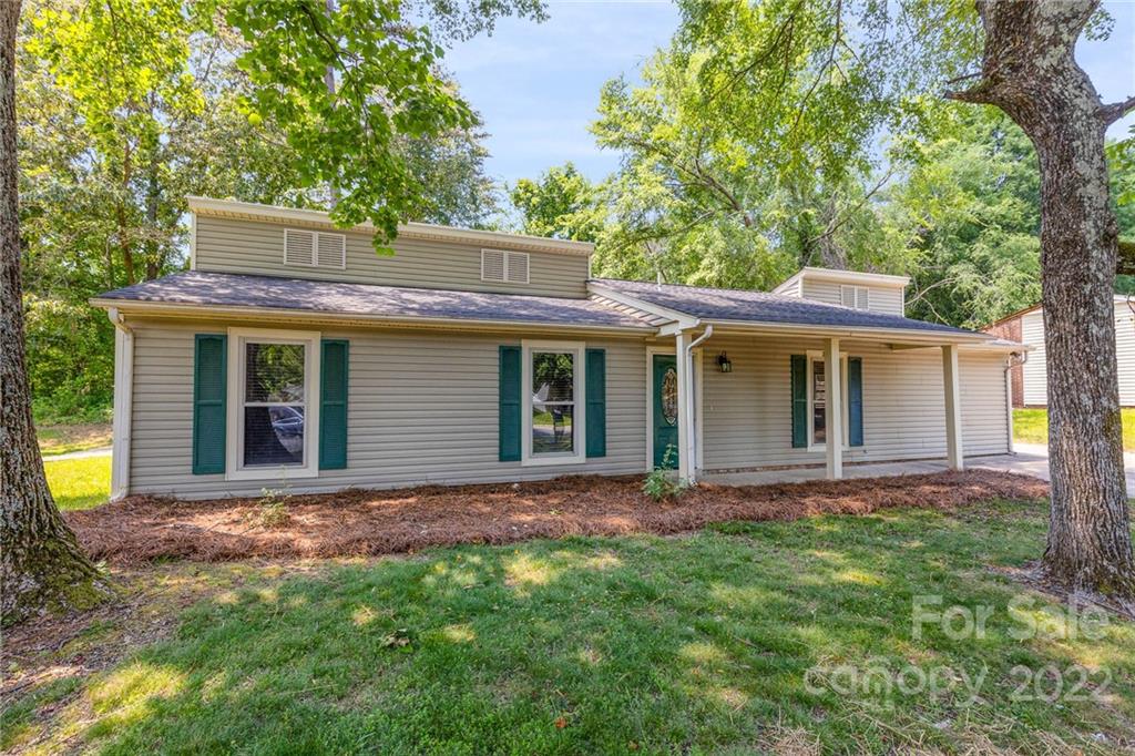 3415 Spring Terrace Lane Charlotte, NC 28269 - Photo 1 of 23 a front view of a house with garden