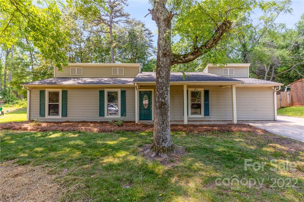 3415 Spring Terrace Lane Charlotte, NC 28269 - Photo 2 of 23 front view of a house with a yard