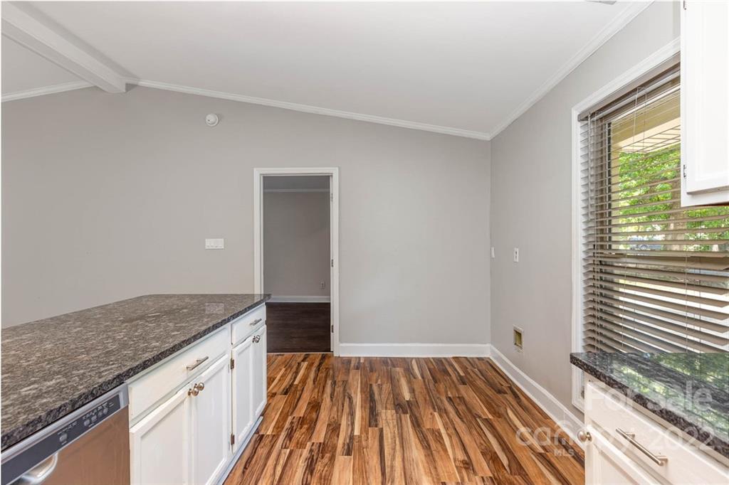 3415 Spring Terrace Lane Charlotte, NC 28269 - Photo 8 of 23 a view of kitchen island wooden floor and wooden floor