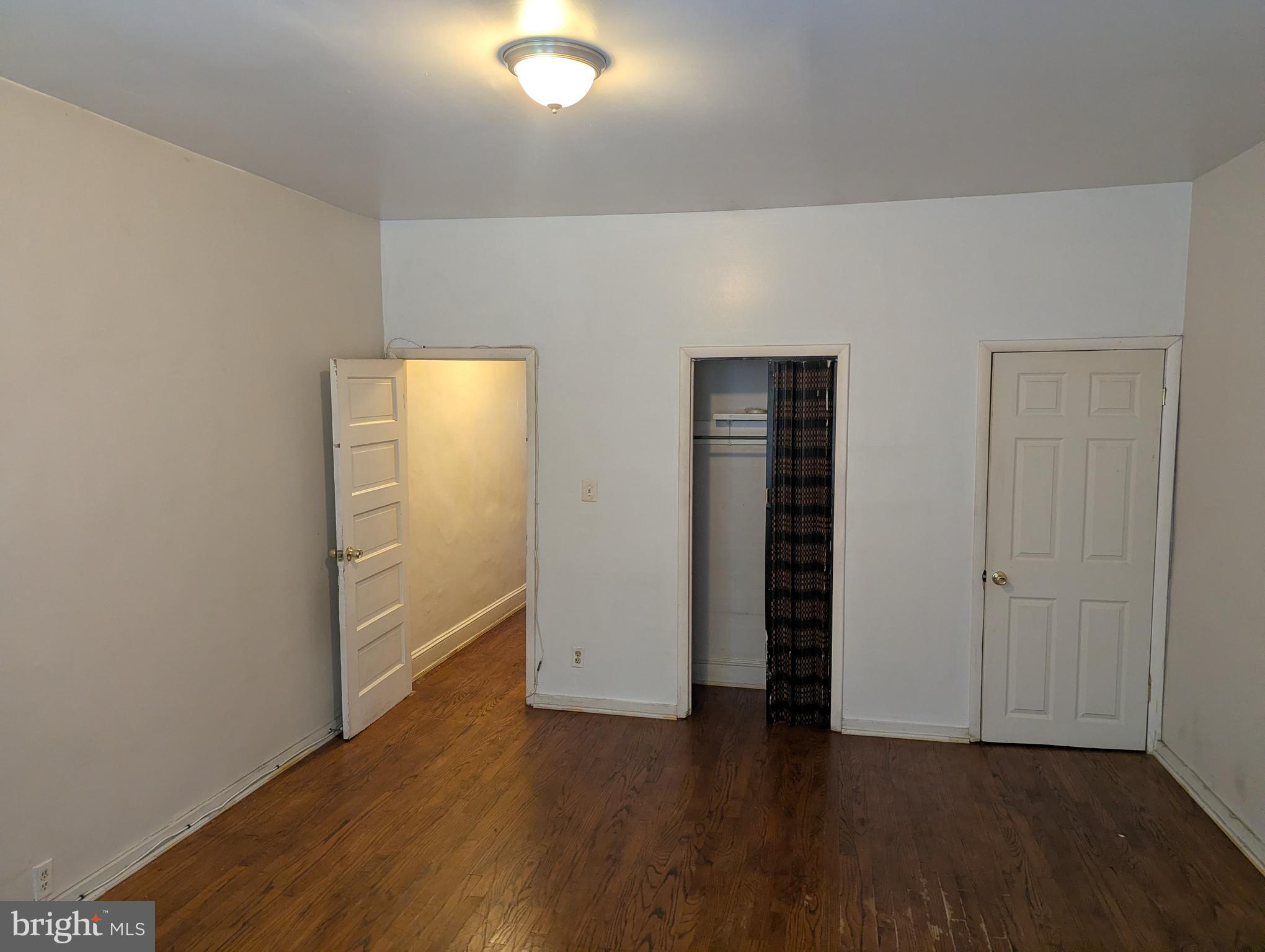 3442 Belair Road Baltimore, MD 21213 - Photo 12 of 27 wooden floor in an empty room