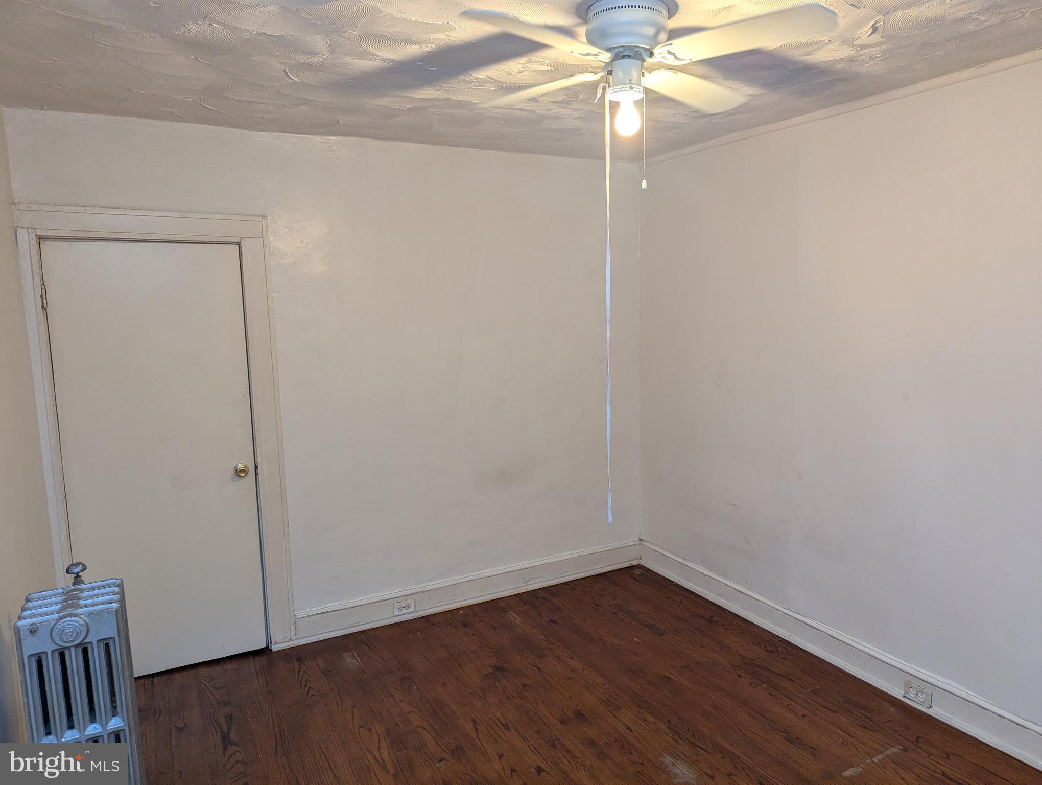 3442 Belair Road Baltimore, MD 21213 - Photo 14 of 27 a view of an empty room with wooden floor