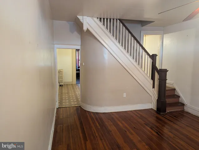 a view of entryway with wooden floor