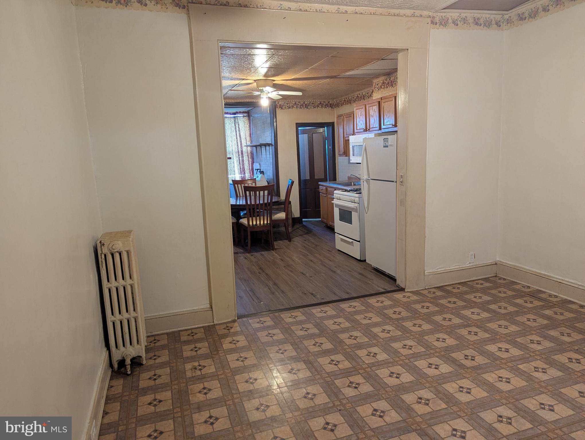 3442 Belair Road Baltimore, MD 21213 - Photo 6 of 27 a view of a hallway with a kitchen