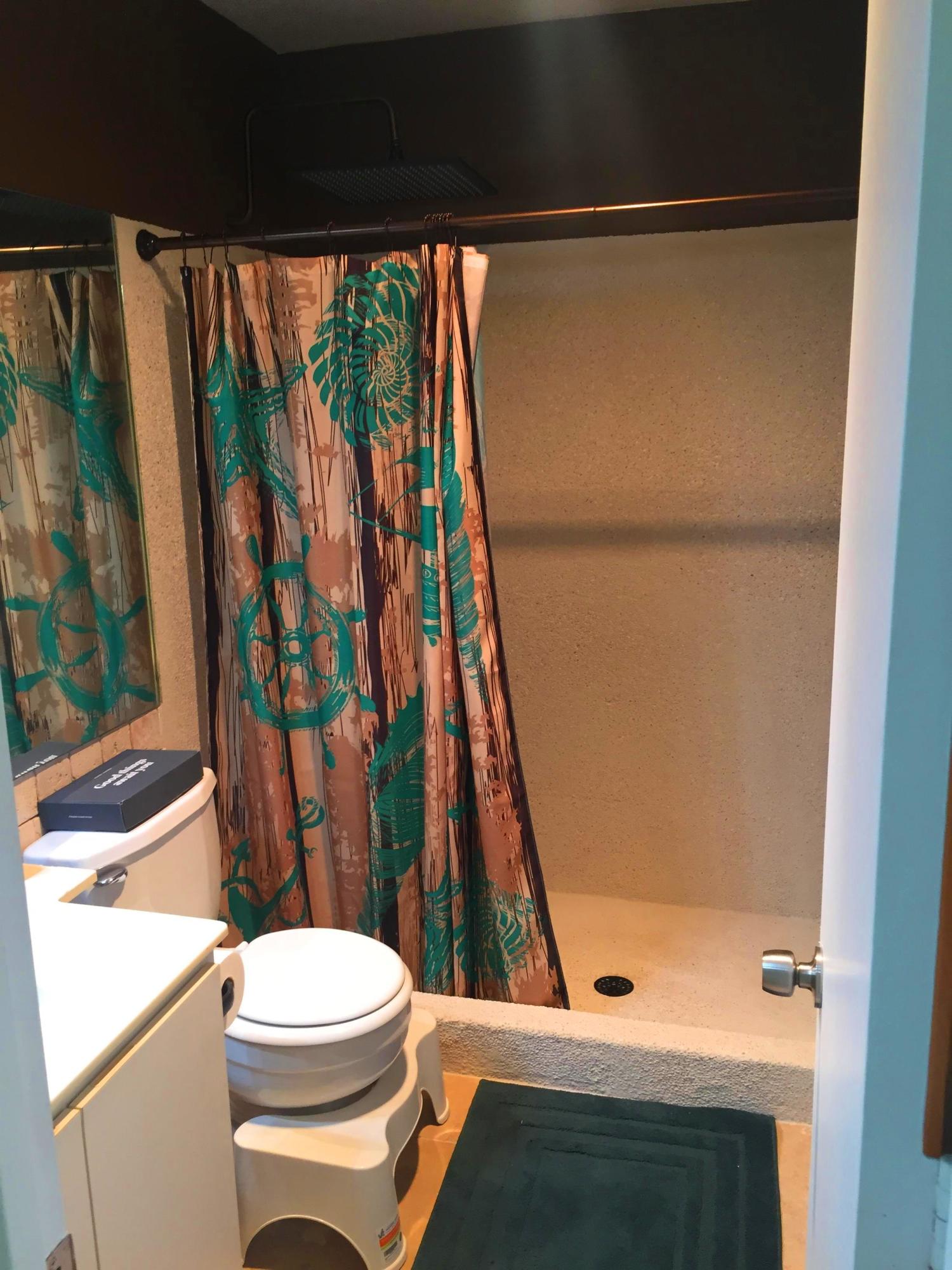 299 Southwest 7th Street, Unit 206 Boca Raton, FL 33432 - Photo 3 of 7 a bathroom with a toilet and a shower