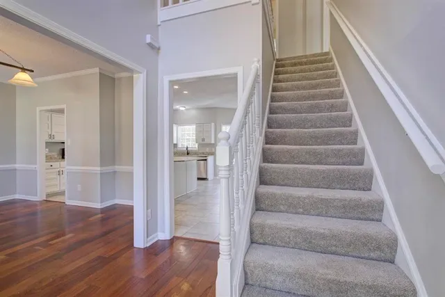 a view of an entryway with wooden floor and door
