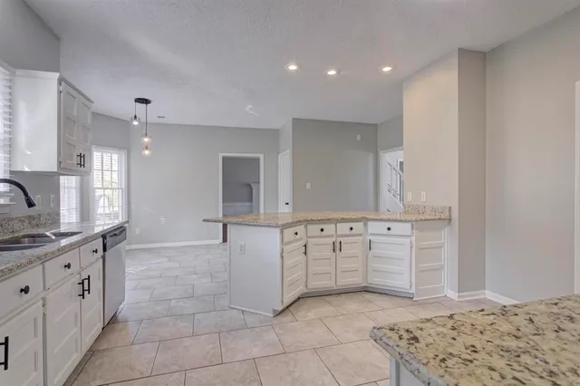 a large bathroom with a sink and a large mirror