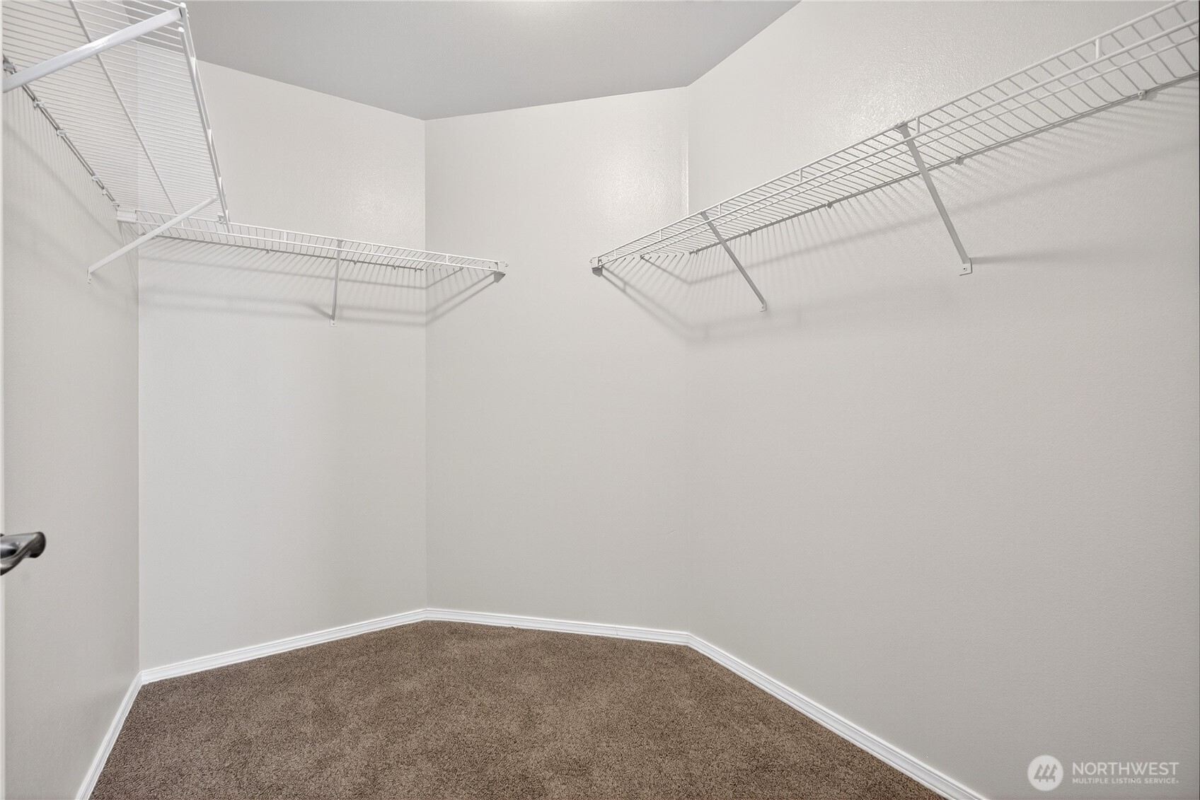 25621 160th Place Southeast Covington, WA 98042 - Photo 20 of 37 a view of a room with racks on the wall