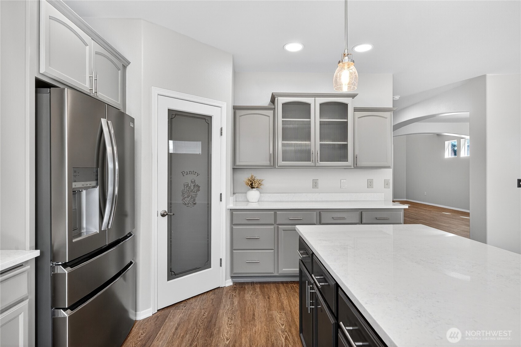 25621 160th Place Southeast Covington, WA 98042 - Photo 7 of 37 a kitchen with a refrigerator sink and cabinets