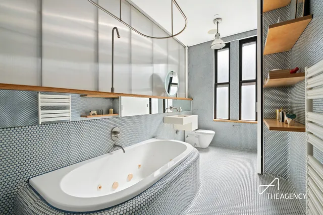 a large white bed in a white room